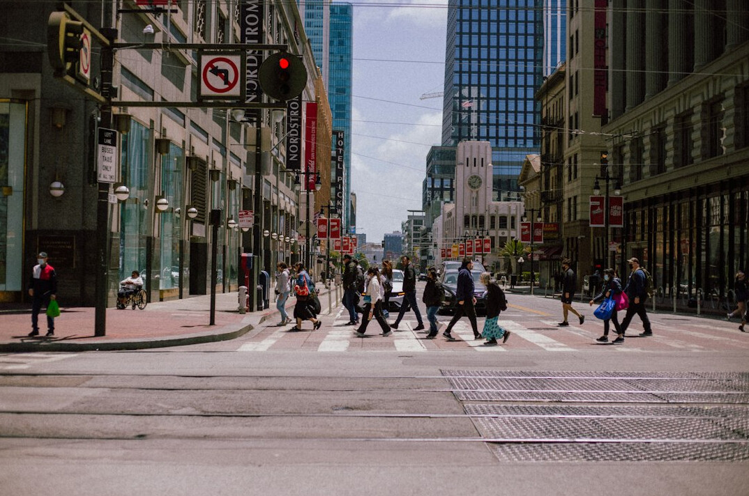 Busy downtown city street with pedestrians