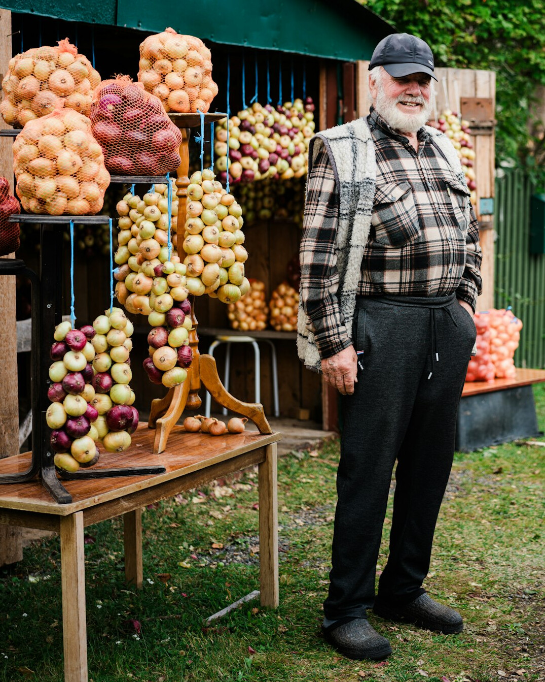 Elderly street market vendor smiling