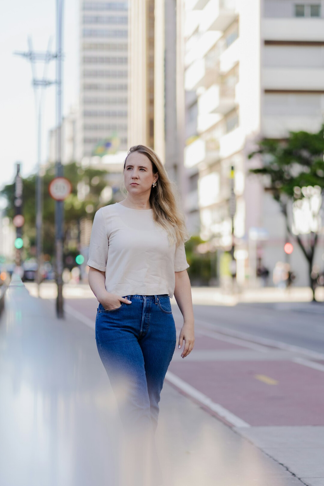 Young woman portrait on a city sidewalk